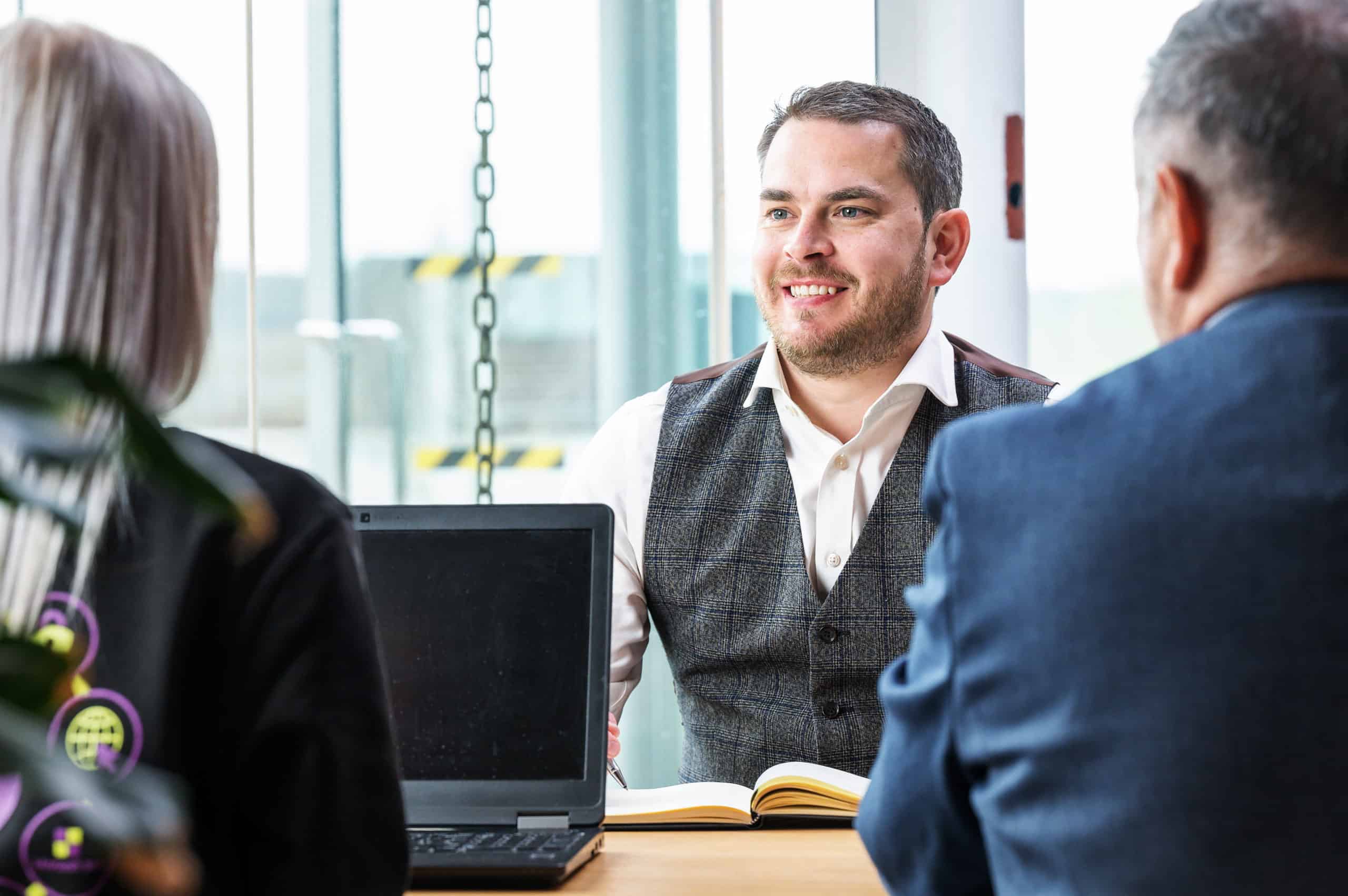 3 Team members discussing IT Support in Brighton & Sussex