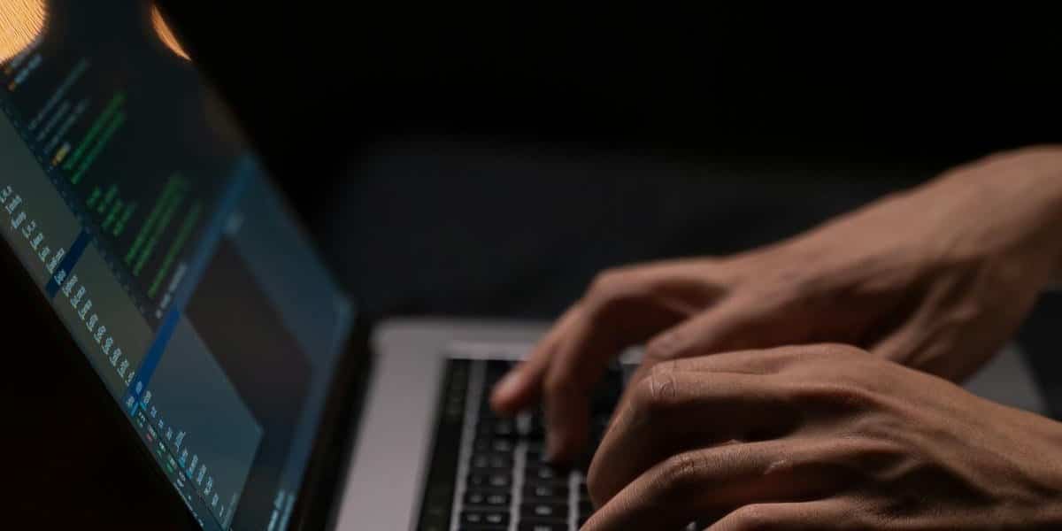 Typing Microsoft 365 Copilot prompts on a laptop keyboard