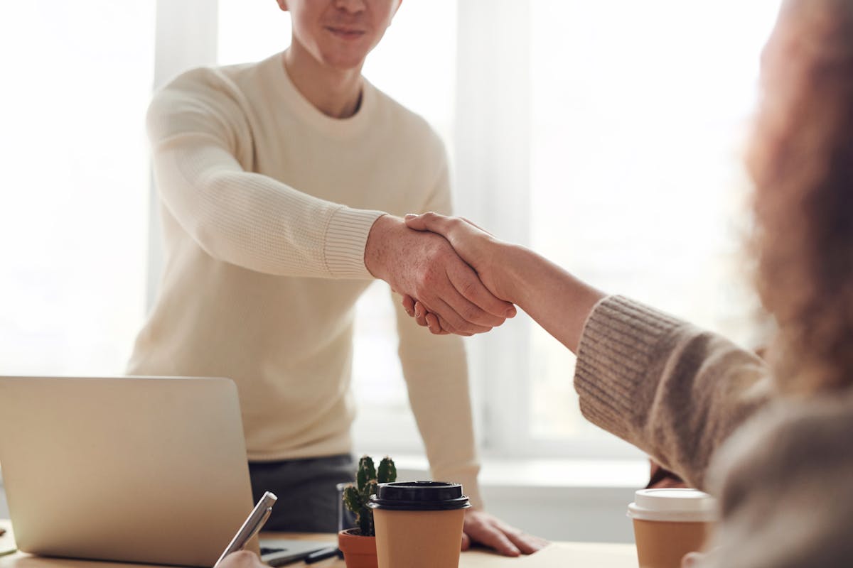 Business handshake symbolising partnership and collaboration.